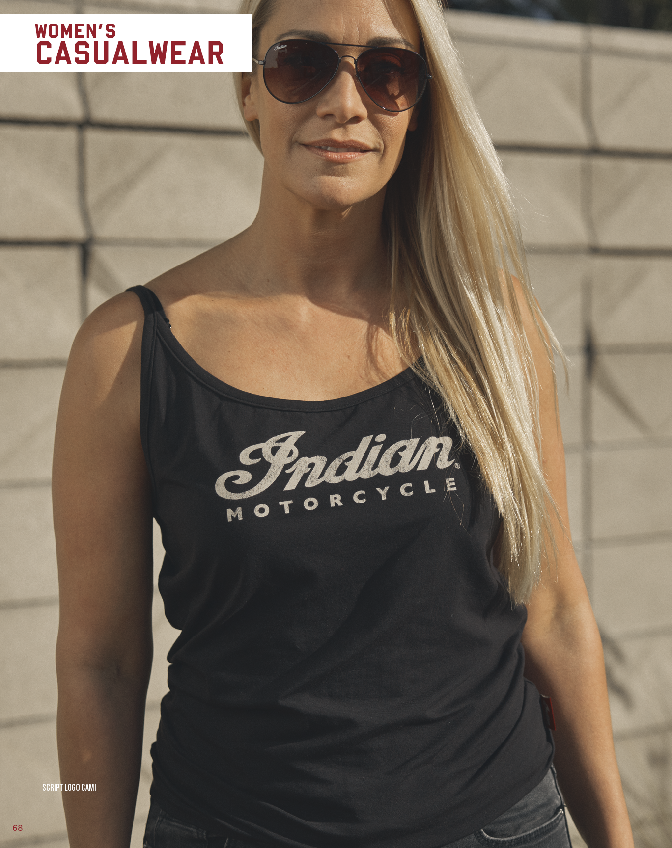 A woman wearing a black tank top with the words Indian Motorcycle on it. AI generated content